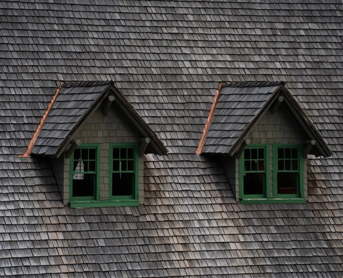 Dormers on a shingle roof in Wilmington, DE, where step flashing and kickout flashing carry water past the walls